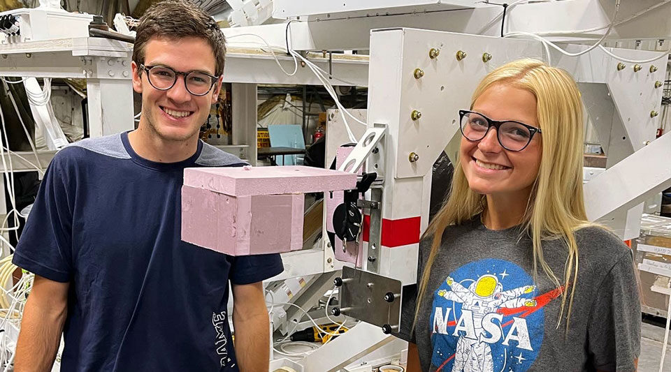 Sarah and Patrick posing with the deployment subsystem after attachment to NASA's gondola.