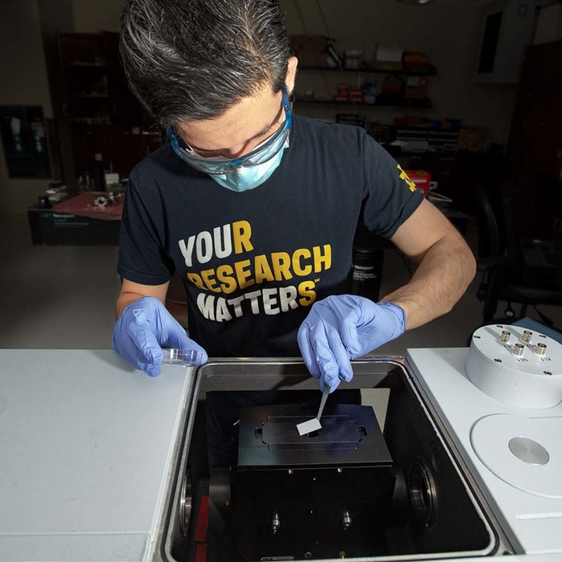 Electrical Engineering Ph.D. student Irfan Khan working in Professor Anthony Hoffman's Photonics Lab